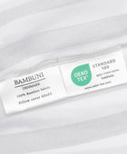 Bamboe beddengoed met witte/olijfkleurige strepen en brede randen