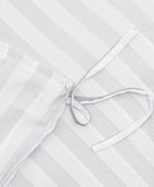 Bamboe beddengoed met witte/olijfkleurige strepen en brede randen