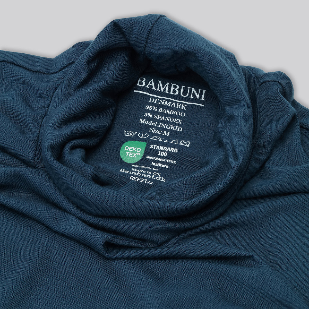 Bambus rullekrave i petroleumsblå til damer carelabel